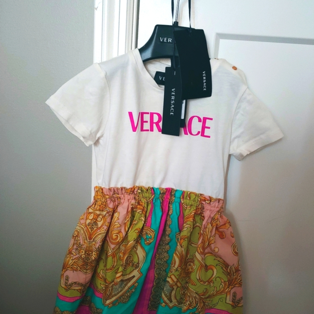 Beautiful 2T versace dress worn once like new. tags included with hanger.